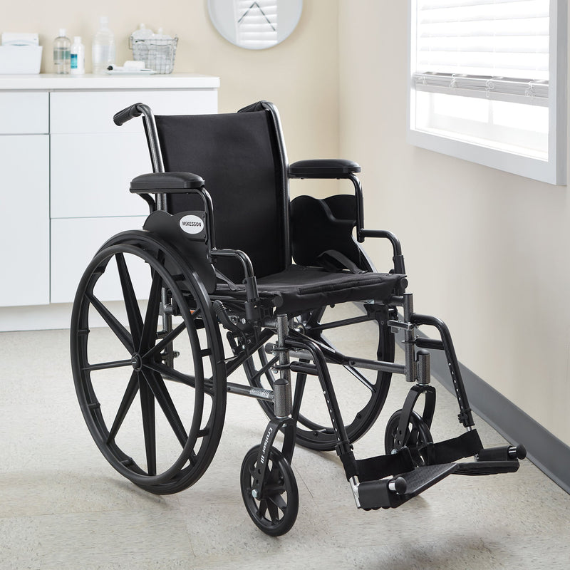 McKesson Lightweight Wheelchair Dual Axle Desk Length Arm Swing-Away Footrest Black Upholstery 16 Inch Seat Width Adult 300 lbs. Weight Capacity (1065282_EA) 1/EA