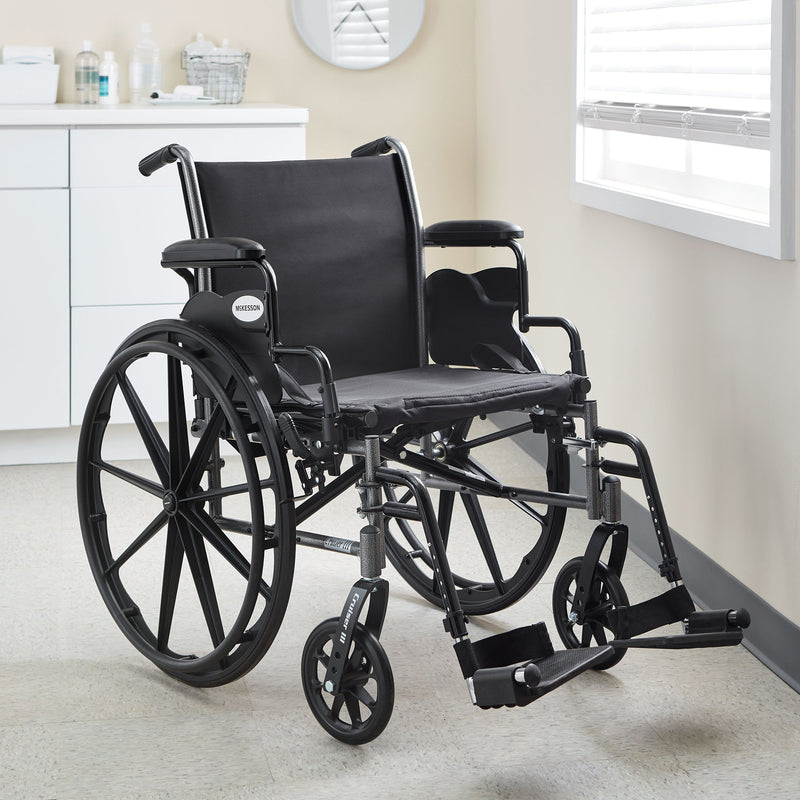 McKesson Lightweight Wheelchair Dual Axle Desk Length Arm Swing-Away Footrest Black Upholstery 20 Inch Seat Width Adult 300 lbs. Weight Capacity (1065286_EA) 1/EA
