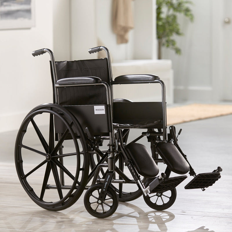 McKesson Wheelchair Dual Axle Full Length Arm Swing-Away Elevating Legrest Black Upholstery 18 Inch Seat Width Adult 300 lbs. Weight Capacity (1065275_EA) 1/EA