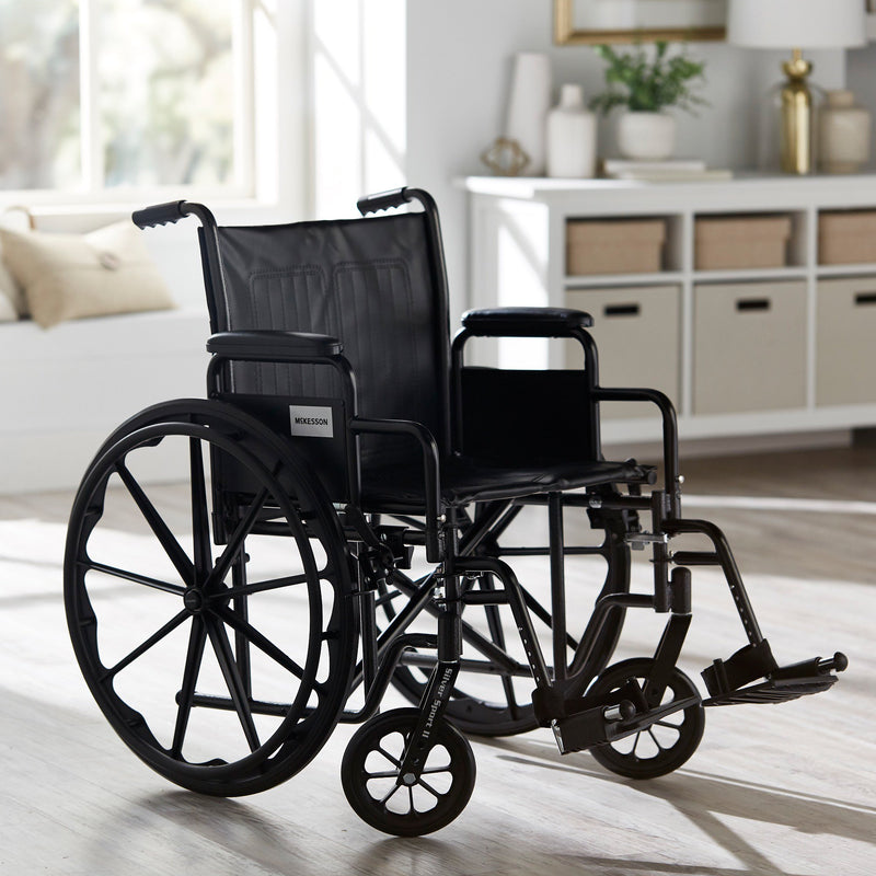 McKesson Wheelchair Dual Axle Desk Length Arm Swing-Away Footrest Black Upholstery 20 Inch Seat Width Adult 350 lbs. Weight Capacity (1065278_EA) 1/EA