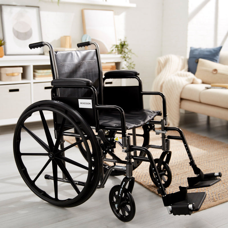 McKesson Wheelchair Dual Axle Desk Length Arm Swing-Away Footrest Black Upholstery 18 Inch Seat Width Adult 300 lbs. Weight Capacity (1065276_EA) 1/EA