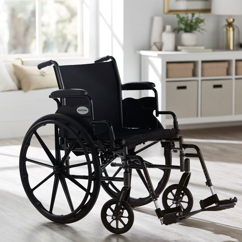 McKesson Lightweight Wheelchair Dual Axle Desk Length Arm Swing-Away Footrest Black Upholstery 20 Inch Seat Width Adult 300 lbs. Weight Capacity (1065286_EA) 1/EA