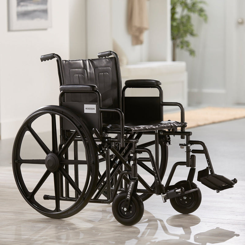 McKesson Bariatric Wheelchair Dual Axle Desk Length Arm Swing-Away Footrest Black Upholstery 22 Inch Seat Width Adult 450 lbs. Weight Capacity (1065280_EA) 1/EA